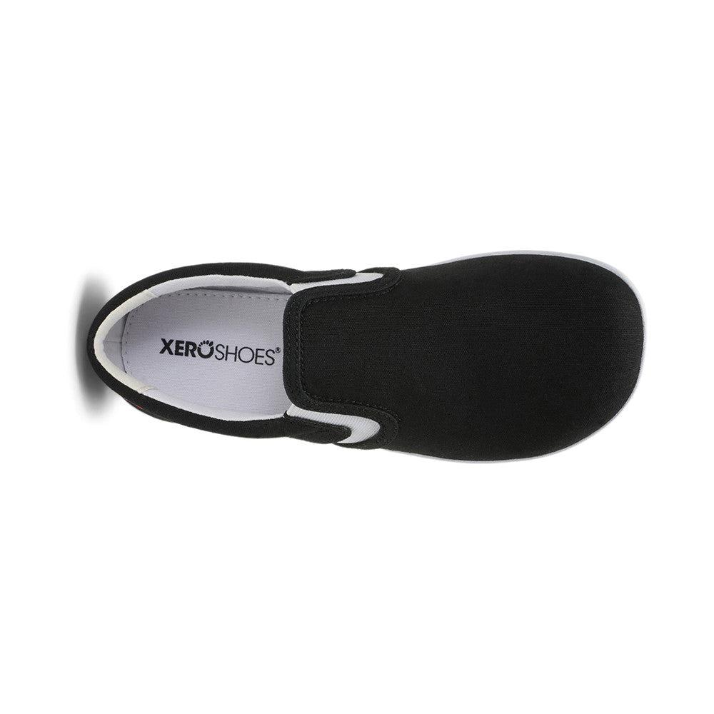 Obere Ansicht der Xero Shoes Dillon Canvas Slip-On Kinder Barfußschuhe in Schwarz als Sneaker im Onlineshop für Barfußschuhe