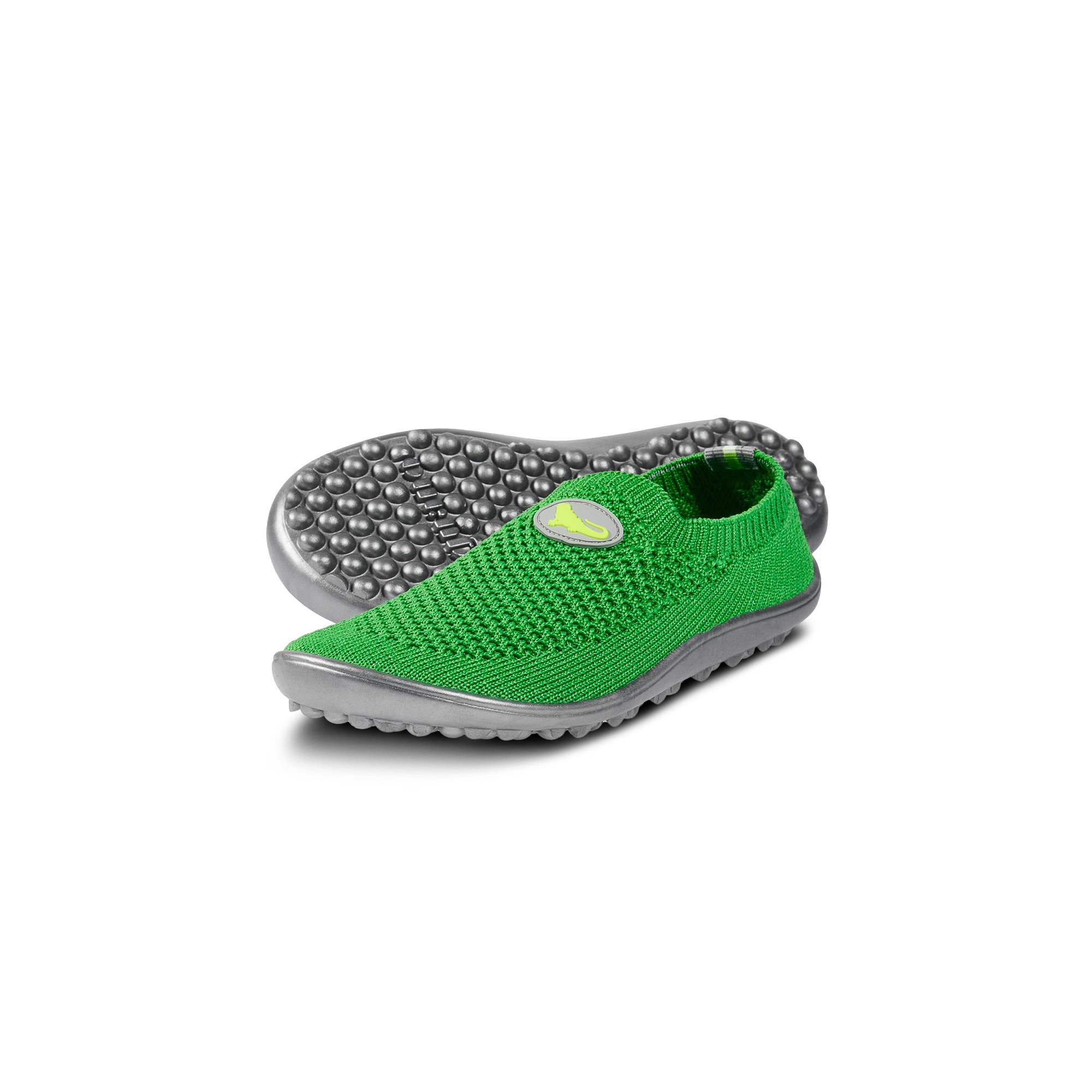 Leguanito Scio Green Kinder Barfußschuhe Slipper – Diese flexiblen Slipper für Kinder in den Größen 23 bis 28 bieten hohen Tragekomfort und sind perfekt für das aktive Spielen. Erhältlich bei barfusswelten.de.