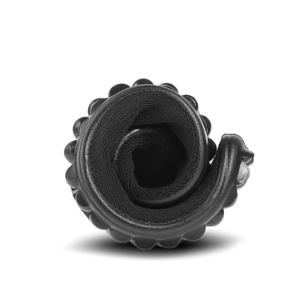 Leguano Sneaker in Schwarz mit weißem Bund, in zusammengerollter Form abgebildet und ideal für einfache Aufbewahrung und flexibles Design. Jetzt erhältlich im Onlineshop für Barfußschuhe.