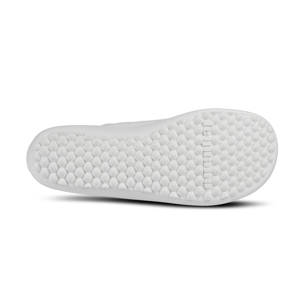 Leguano Scio Barfußslipper in Weiß, von unten abgebildet und ideal für minimalistisches Gehen. Jetzt erhältlich im Onlineshop für Barfußschuhe.